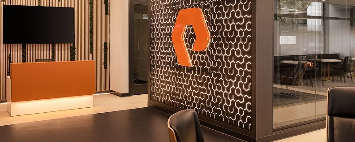 Contemporary workspace featuring a prominent logo and stylish reception desk